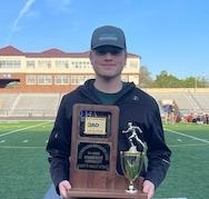 Joey Valeri '25 holding a trophy